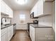 Contemporary kitchen featuring stainless steel appliances, bright white cabinets, and granite countertops at 735 Green St, Rock Hill, SC 29730