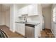 Well-lit kitchen with granite counters, stainless steel dishwasher, and bright white cabinets at 735 Green St, Rock Hill, SC 29730