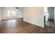 Bright living area with hardwood floors, white walls, and views of the modern kitchen at 735 Green St, Rock Hill, SC 29730