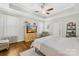 Spacious bedroom with a hardwood floors, a ceiling fan, and a large window at 7362 Vanguard Ct, Stanley, NC 28164