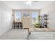 Well-lit bedroom with a cozy atmosphere, a spacious closet, and a serene design with ample sunlight at 7362 Vanguard Ct, Stanley, NC 28164