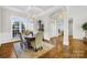 Dining room with wainscoting, a chandelier, and natural light at 7362 Vanguard Ct, Stanley, NC 28164
