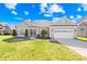 Charming one-story home featuring manicured lawn, landscaped entryway and a two car garage at 7362 Vanguard Ct, Stanley, NC 28164