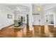 Elegant foyer with hardwood floors and arched entryways to the living spaces at 7362 Vanguard Ct, Stanley, NC 28164