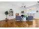 Bright living room with fireplace, hardwood floors, and a cozy seating arrangement at 7362 Vanguard Ct, Stanley, NC 28164