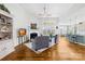 Spacious living room featuring fireplace, hardwood floors, and stylish seating at 7362 Vanguard Ct, Stanley, NC 28164