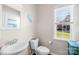 This cozy powder room features modern fixtures, natural light, and tasteful decor for a welcoming touch at 7362 Vanguard Ct, Stanley, NC 28164