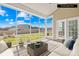 Cozy screened porch with comfortable seating, perfect for relaxation at 7362 Vanguard Ct, Stanley, NC 28164