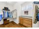 This spacious walk-in closet with custom organizers and ample natural light offers stylish storage solutions at 7362 Vanguard Ct, Stanley, NC 28164