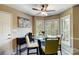 Bright dining nook with a modern table, chairs, and large windows at 7921 Altacrest Dr, Concord, NC 28027