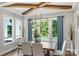 Elegant dining room featuring wood beams, a modern chandelier, and large windows with a view at Lot 17 Ridgeview Ln, Iron Station, NC 28080