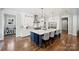 Elegant kitchen with large island, stainless steel appliances, and designer lighting at Lot 17 Ridgeview Ln, Iron Station, NC 28080