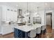 Bright and airy kitchen featuring a large island, modern appliances, and stylish pendant lighting at Lot 17 Ridgeview Ln, Iron Station, NC 28080