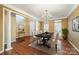 Elegant dining room with hardwood floors, chandelier, and lots of natural light at 10349 Linksland Dr, Huntersville, NC 28078