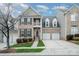 Charming brick two-story home features a balcony and a two-car garage at 10349 Linksland Dr, Huntersville, NC 28078