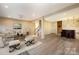 Finished basement featuring wood vinyl flooring, a bar, neutral walls, and lots of space to entertain at 10349 Linksland Dr, Huntersville, NC 28078