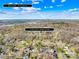 Aerial view of the neighborhood, home location, and a view of Uptown Charlotte's skyline at 1133 Bloom Wood Ln, Matthews, NC 28105