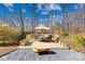 Backyard deck with comfortable outdoor seating, picnic table, and a shaded umbrella perfect for relaxing at 1133 Bloom Wood Ln, Matthews, NC 28105