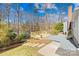 Inviting backyard deck with wooden railings, surrounded by trees, offering a tranquil outdoor space at 1133 Bloom Wood Ln, Matthews, NC 28105
