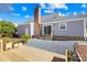 The backyard features a deck, brick chimney, and steps from the house to a pea gravel bed at 1133 Bloom Wood Ln, Matthews, NC 28105