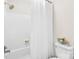 Bright bathroom featuring a white tub/shower combo with a white shower curtain at 1133 Bloom Wood Ln, Matthews, NC 28105