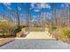 Inviting deck with wooden railings and gravel border, perfect for relaxing and entertaining outdoors at 1133 Bloom Wood Ln, Matthews, NC 28105