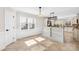 Eat-in kitchen with tile flooring, beaded wainscotting, granite countertops, and a modern light fixture at 1133 Bloom Wood Ln, Matthews, NC 28105