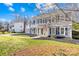 Attractive two-story home with black shutters, blue siding, a well-kept lawn, and freshly mulched garden beds at 1133 Bloom Wood Ln, Matthews, NC 28105