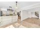 Open kitchen with granite countertops, stainless steel appliances, and a view to the living area with fireplace at 1133 Bloom Wood Ln, Matthews, NC 28105