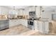 Modern kitchen featuring stainless steel oven and microwave, granite counters, and tile backsplash at 1133 Bloom Wood Ln, Matthews, NC 28105