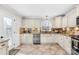 Well-lit kitchen featuring granite countertops, stainless steel appliances, and a view from the kitchen window at 1133 Bloom Wood Ln, Matthews, NC 28105