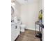 Stylish powder room with wood flooring and decorative accents at 1133 Bloom Wood Ln, Matthews, NC 28105