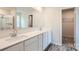 Modern bathroom featuring dual sinks, white countertops and a walk-in shower at 116 Dorian Pl, Troutman, NC 28166