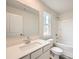 Clean bathroom with white cabinets, single sink vanity, toilet, and shower/tub combo at 116 Dorian Pl, Troutman, NC 28166