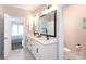 Bright bathroom featuring a double sink vanity, modern fixtures, and a view to the bedroom at 12609 Twilight Dr, Mint Hill, NC 28227