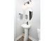 Modern powder room with pedestal sink, stylish lighting, and updated fixtures at 12609 Twilight Dr, Mint Hill, NC 28227