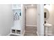Mud room entry with built-in bench and storage leading into the powder room at 12609 Twilight Dr, Mint Hill, NC 28227