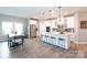 Spacious kitchen features stainless steel appliances, a large island, and modern lighting at 12609 Twilight Dr, Mint Hill, NC 28227