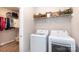 Functional laundry room with modern washer, dryer and storage space at 12609 Twilight Dr, Mint Hill, NC 28227