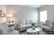 Inviting living room with neutral tones, stylish furniture, and ample natural light at 12609 Twilight Dr, Mint Hill, NC 28227