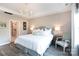 Elegant main bedroom with hardwood floors, a chandelier, and ensuite bathroom access at 12609 Twilight Dr, Mint Hill, NC 28227