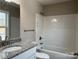 Bathroom featuring a shower over tub and granite countertops at 1425 Wildwood Dr, Kannapolis, NC 28081