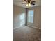 Bedroom with carpet floors, a ceiling fan, and a window at 1425 Wildwood Dr, Kannapolis, NC 28081