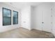 Bright bedroom with hardwood floors, windows, and closet at 17201 Green Hill Rd, Charlotte, NC 28278