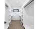 Spacious walk-in closet with custom shelving and a window for natural light at 17201 Green Hill Rd, Charlotte, NC 28278