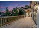 Spacious outdoor deck featuring wood railings, fan, and neighborhood views at 17201 Green Hill Rd, Charlotte, NC 28278