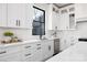 Modern kitchen showcases sleek white cabinetry, quartz countertops, and stainless steel appliances at 17201 Green Hill Rd, Charlotte, NC 28278