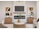 Cozy living room featuring a modern fireplace, stylish decor, and a sleek, contemporary design at 17201 Green Hill Rd, Charlotte, NC 28278