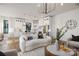Bright, open layout connecting the living room and kitchen, featuring white cabinets and modern lighting at 17201 Green Hill Rd, Charlotte, NC 28278