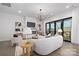 Inviting living room featuring a modern fireplace, comfortable seating, and large sliding glass doors at 17201 Green Hill Rd, Charlotte, NC 28278
